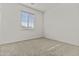 This bedroom has neutral carpet, a window with blinds, and plenty of natural light at 3263 S Miller Dr, Chandler, AZ 85286