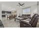 Open-concept living area with tile flooring, modern furnishings, and an adjacent dining space for versatile living at 3263 S Miller Dr, Chandler, AZ 85286