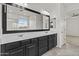 Double sink vanity in the main bath next to the glass shower and toilet room at 3263 S Miller Dr, Chandler, AZ 85286