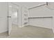 Spacious walk-in closet with built in shelves and plenty of room to store all your clothing at 3263 S Miller Dr, Chandler, AZ 85286