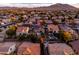 Panoramic aerial view of a property nestled in a charming neighborhood, complete with solar panels and a pool at 3274 E Isaiah Ct, Gilbert, AZ 85298