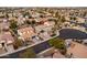 Aerial view of a well-maintained home with solar panels, a landscaped yard, and a nearby cul-de-sac at 3274 E Isaiah Ct, Gilbert, AZ 85298