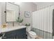 Well-lit bathroom featuring a blue vanity with quartz countertop and modern fixtures at 3274 E Isaiah Ct, Gilbert, AZ 85298