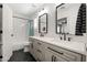 Bright bathroom featuring a double vanity, stylish mirrors, and modern fixtures, designed for both functionality and aesthetics at 3274 E Isaiah Ct, Gilbert, AZ 85298