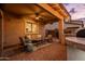 Covered patio with comfortable seating and an outdoor kitchen area at 3274 E Isaiah Ct, Gilbert, AZ 85298