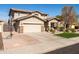 Lovely two-story home featuring a spacious driveway, stone accents, and a welcoming front porch at 3274 E Isaiah Ct, Gilbert, AZ 85298