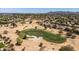 Aerial view of the golf course showcasing the lush green fairways, sand traps, and mature trees throughout the community at 3274 E Isaiah Ct, Gilbert, AZ 85298