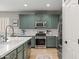 This kitchen features shaker cabinets, stainless appliances, granite counters and a subway tile backsplash at 3274 E Isaiah Ct, Gilbert, AZ 85298