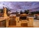 Well-equipped outdoor kitchen featuring stainless steel grill, side burners, and ample counter space for backyard entertaining at 3274 E Isaiah Ct, Gilbert, AZ 85298