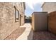 Functional side yard with a storage shed and paved walkway, providing extra storage and accessibility at 3274 E Isaiah Ct, Gilbert, AZ 85298