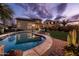 Stunning backyard with a pool and hot tub, surrounded by desert landscaping, perfect for luxurious outdoor living at 3274 E Isaiah Ct, Gilbert, AZ 85298