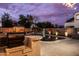 Serene backyard swimming pool featuring lush landscaping, a relaxing gazebo, and a built-in BBQ for entertaining at 3274 E Isaiah Ct, Gilbert, AZ 85298