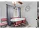 Charming dining area featuring a vintage table and chairs complemented by a modern wall clock at 4022 W Kaler Dr, Phoenix, AZ 85051