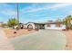 Charming home featuring an arched carport and minimalist landscaping at 4022 W Kaler Dr, Phoenix, AZ 85051