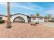 Charming home showcasing an arched entryway and minimalist landscaping at 4022 W Kaler Dr, Phoenix, AZ 85051