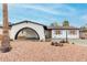 Charming home showcasing an arched entryway and minimalist landscaping at 4022 W Kaler Dr, Phoenix, AZ 85051