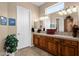 Cozy bathroom features neutral colors, a large vanity area, and natural lighting at 4221 E Sourwood Dr, Gilbert, AZ 85298