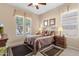 Well-lit bedroom boasts a ceiling fan, decorative elements, and neutral color palette at 4221 E Sourwood Dr, Gilbert, AZ 85298