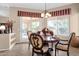 Charming dining area featuring a round table and chairs with views to the exterior patio at 4221 E Sourwood Dr, Gilbert, AZ 85298