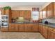 Well-equipped kitchen featuring tile backsplash, stainless steel appliances and ample countertop space at 4221 E Sourwood Dr, Gilbert, AZ 85298