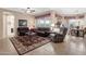 Spacious living room featuring tile floors, a ceiling fan, and views of the dining area at 4221 E Sourwood Dr, Gilbert, AZ 85298