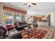 Open-concept living room with tile flooring, seamlessly connecting to the kitchen space at 4221 E Sourwood Dr, Gilbert, AZ 85298