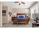 Serene main bedroom with a dark wood furnishing, plush carpet and bright natural light at 4221 E Sourwood Dr, Gilbert, AZ 85298