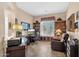 Home office with built-in bookshelves and cabinets, a large desk, and natural lighting at 4221 E Sourwood Dr, Gilbert, AZ 85298