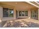 A covered patio offers shade with brick pavers, recessed lights, and multiple windows for natural light at 4221 E Sourwood Dr, Gilbert, AZ 85298