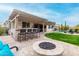 Wonderful backyard with built-in barbecue, bar seating, firepit, and grassy area at 4455 S Matter --, Mesa, AZ 85212