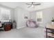 Spacious bedroom featuring plush beanbag chair, desk, and natural light from large windows at 4455 S Matter --, Mesa, AZ 85212