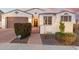 Charming home exterior with manicured landscaping, a gated entrance, and a warm, inviting entryway at 4455 S Matter --, Mesa, AZ 85212