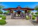 A community gathering place with chairs and tables under a gazebo structure at 4455 S Matter --, Mesa, AZ 85212