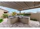 Outdoor kitchen with natural gas grill, ample counterspace, and bar seating at 4455 S Matter --, Mesa, AZ 85212