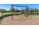 Community playground with swings and a slide offers outdoor recreation at 4455 S Matter --, Mesa, AZ 85212