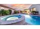 Backyard with a luxurious pool and spa and outdoor seating area for relaxing evenings at 4455 S Matter --, Mesa, AZ 85212