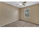 A bedroom with carpet, light walls, and a window at 44983 W Sage Brush Dr, Maricopa, AZ 85139