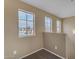 Upstairs loft area with natural light streaming through multiple windows at 44983 W Sage Brush Dr, Maricopa, AZ 85139