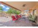 Inviting covered patio with comfortable seating, perfect for outdoor entertaining at 4510 E Emelita Ave, Mesa, AZ 85206