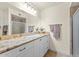 Well-lit bathroom with vanity, quartz countertop, and tiled shower at 4510 E Emelita Ave, Mesa, AZ 85206