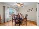 Cozy dining room with hardwood floors, modern lighting, and comfortable seating for six at 4510 E Emelita Ave, Mesa, AZ 85206