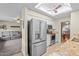 Modern kitchen with stainless steel appliances, granite countertops, and white cabinetry at 4510 E Emelita Ave, Mesa, AZ 85206