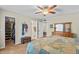 Bedroom featuring neutral walls, ceiling fan, ensuite bathroom, and walk-in closet at 4510 E Emelita Ave, Mesa, AZ 85206