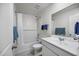 Clean bathroom with a shower-tub combo, white subway tile, and a modern vanity at 47558 W Mellen Ln, Maricopa, AZ 85139