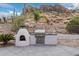 A built in barbeque and pizza oven perfect for outdoor cooking and backyard entertaining at 4822 S Gold Canyon Dr, Gold Canyon, AZ 85118