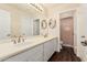 Bathroom featuring a double sink vanity with white cabinets and wood flooring at 4822 S Gold Canyon Dr, Gold Canyon, AZ 85118