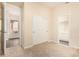 Neutral bedroom with carpet floors, a closet, and doors to the hallway and en-suite bathroom at 4822 S Gold Canyon Dr, Gold Canyon, AZ 85118