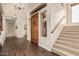 Welcoming foyer with hardwood floors, wooden door, staircase, and high ceilings at 4822 S Gold Canyon Dr, Gold Canyon, AZ 85118