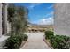 Scenic view of the property showcasing a tile walkway, desert plants and shrubs, and mountain views beyond at 4822 S Gold Canyon Dr, Gold Canyon, AZ 85118