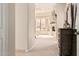 Hallway view leading to a living area featuring a fireplace and desert views at 4822 S Gold Canyon Dr, Gold Canyon, AZ 85118